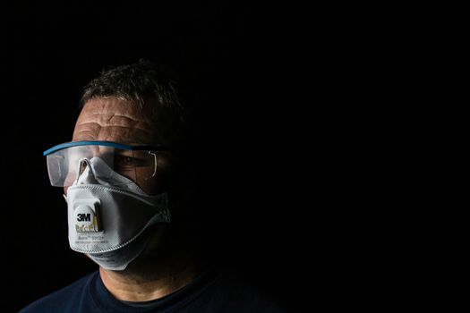 Man with protective 3M medical mask. 3M Aura 9312. The face mask used in the COVID-19 global pandemic as a protection against coronavirus in Bucharest, Romania, 2020