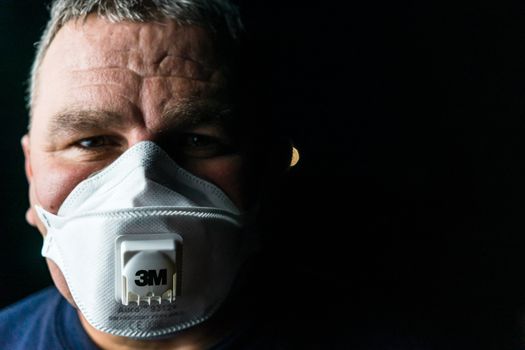 Man with protective 3M medical mask. 3M Aura 9312. The face mask used in the COVID-19 global pandemic as a protection against coronavirus in Bucharest, Romania, 2020