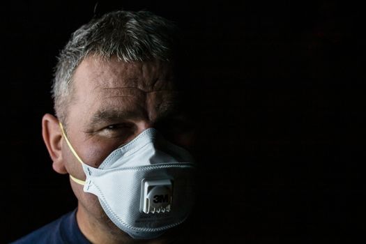 Man with protective 3M medical mask. 3M Aura 9312. The face mask used in the COVID-19 global pandemic as a protection against coronavirus in Bucharest, Romania, 2020