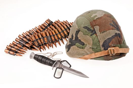 Army helmet, cartridges, knife and badge on isolated background