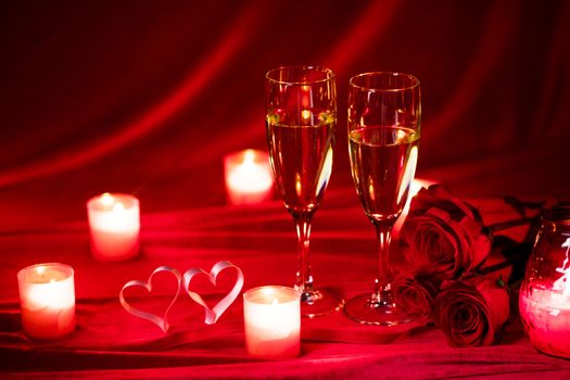 Valentines day background with champagne glasses roses candles and hearts