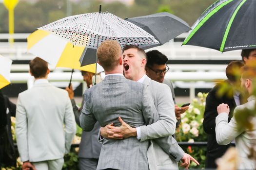 MELBOURNE, AUSTRALIA - NOVEMBER 2: Drunk punters at the end of Derby Day at the 2019 Melbourne Cup Carnival at Flemington Racecourse in Melbourne Australia