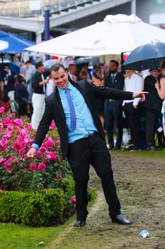 MELBOURNE, AUSTRALIA - NOVEMBER 6: Guests braving the rain at Lexus Melbourne Cup Day at the 2018 Melbourne Cup Carnival