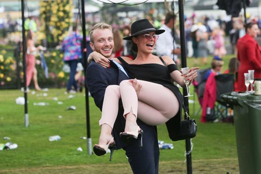 MELBOURNE, AUSTRALIA - NOVEMBER 6: Drunk punters at the end of the day during the Lexus Melbourne Cup Day at the 2018 Melbourne Cup Carnival