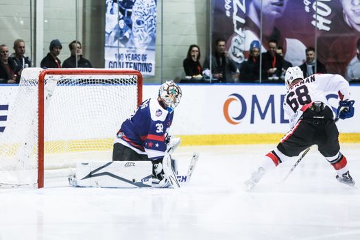 MELBOURNE, AUSTRALIA - JUNE 21: Max Strang of USA defends against Shane Heffernan of Canada in the 2019 Ice Hockey Classic in Melbourne, Australia