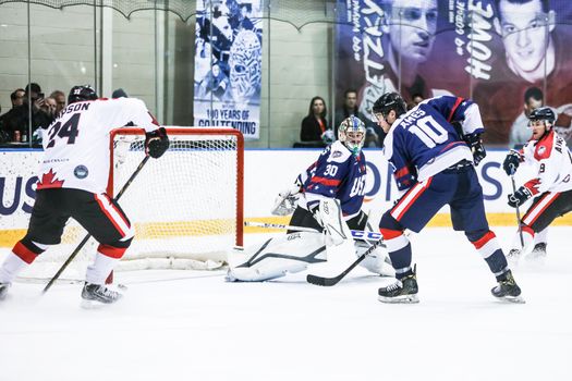 MELBOURNE, AUSTRALIA - JUNE 21: Max Strang of USA watches Reid Simpson of Canada score a goal in the 2019 Ice Hockey Classic in Melbourne, Australia
