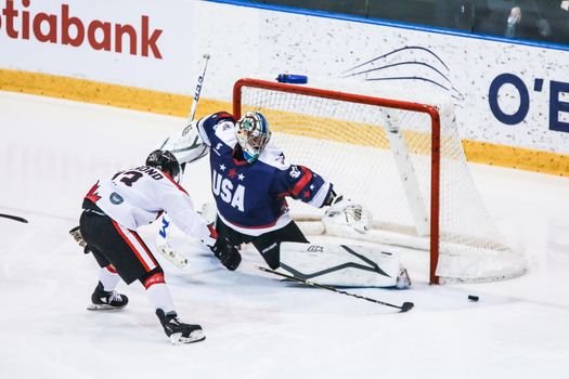 MELBOURNE, AUSTRALIA - JUNE 21: Max Strang of USA defends against Vincent Guimond of Canada in the 2019 Ice Hockey Classic in Melbourne, Australia
