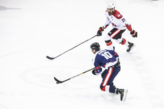 MELBOURNE, AUSTRALIA - JUNE 21: Preston Ames of USA skates with the puck in the 2019 Ice Hockey Classic in Melbourne, Australia
