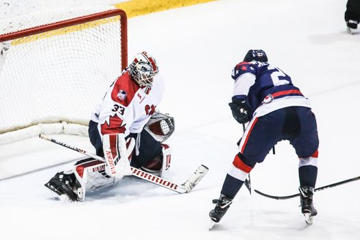 MELBOURNE, AUSTRALIA - JUNE 21: Chris Driedger of Canada stops a shot in the 2019 Ice Hockey Classic in Melbourne, Australia