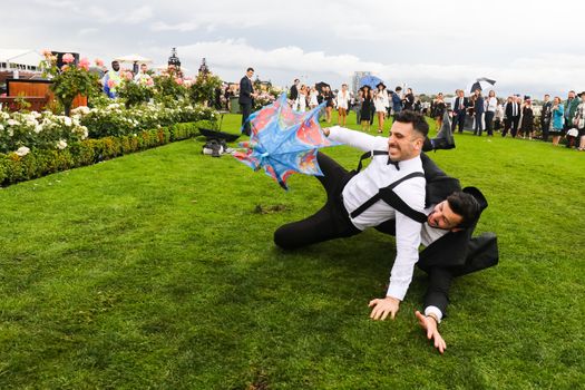 MELBOURNE, AUSTRALIA - NOVEMBER 2: Drunk punters at the end of Derby Day at the 2019 Melbourne Cup Carnival at Flemington Racecourse in Melbourne Australia