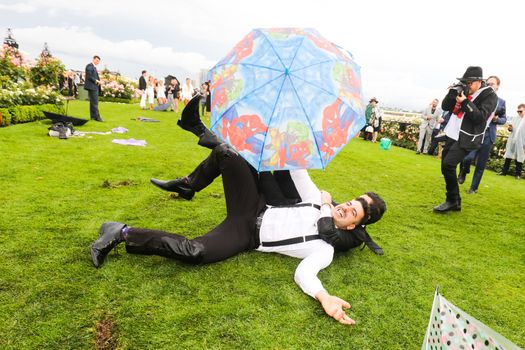 MELBOURNE, AUSTRALIA - NOVEMBER 2: Drunk punters at the end of Derby Day at the 2019 Melbourne Cup Carnival at Flemington Racecourse in Melbourne Australia