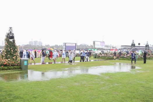 MELBOURNE, AUSTRALIA - NOVEMBER 6: Guests braving the rain on Lexus Melbourne Cup Day at the 2018 Melbourne Cup Carnival