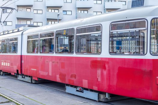 tram at the stop in the city center, public transport.