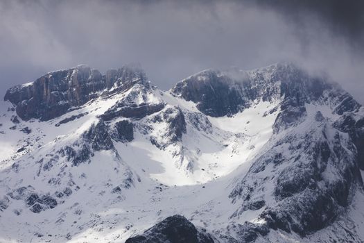 Snowy mountains landscape in the Aragonese Pyrenees. Aguas Tuertas valley, Hecho and Anso, Huesca, Spain.