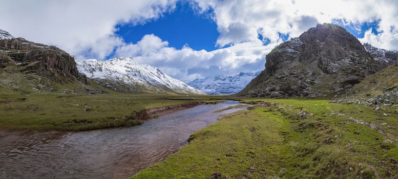 Snowy mountains panoramic landscape in the Aragonese Pyrenees. Aguas Tuertas valley, Hecho and Anso, Huesca, Spain.