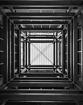 Upward view inside metal tower construction 