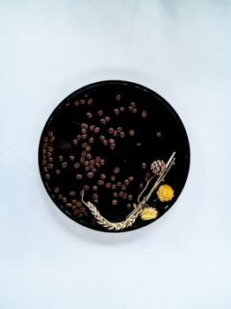 Black Metal tray with coffee beans wheat and flowers