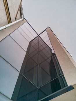 Building glassy walls reflecting in adjacent windows