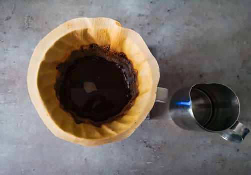 Top down look to dripper with black coffee