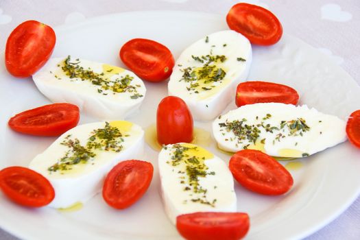 italian appetizer mozzarella cherry tomatoes oregano and oil