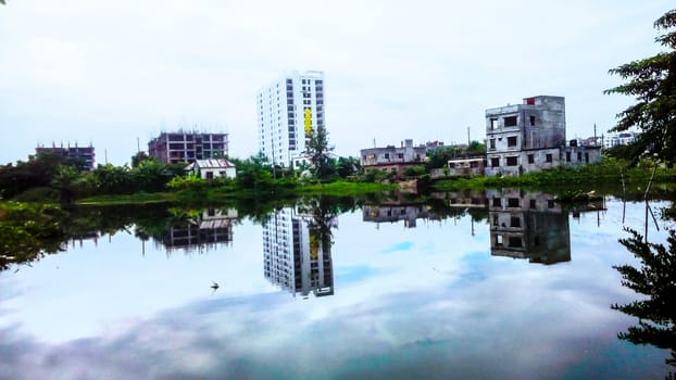 appartment and lake with sky in city