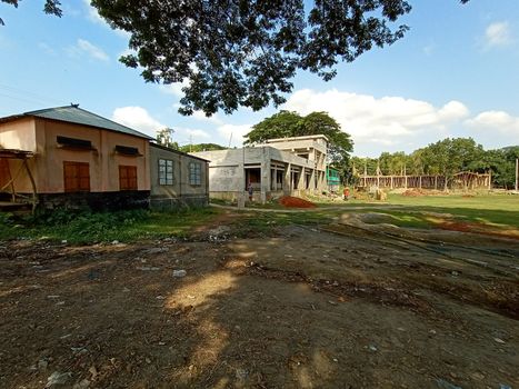 school and field view with nature