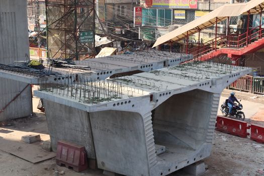 metro rail fly over line view with construction equipment