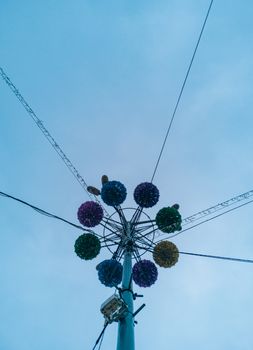 Upward view to city lantern with christmas decorations around