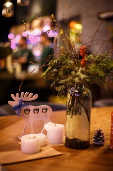 Minimalistic Christmas decor cozy warm room with wooden furniture.