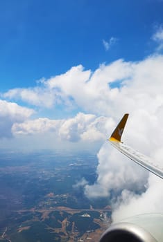 View from the airplane window on the wing with the engine. Flight by plane.