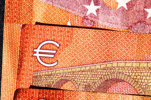 Selective focus on detail of euro banknotes. Close up macro detail of money banknotes, 10 euro isolated. World money concept, inflation and economy concept