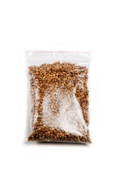 Spinach seeds in germination bag on a white background.