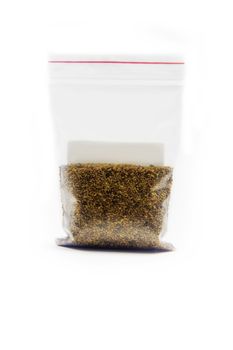 .Alfalfa seeds for germination in bag isolated on a white background.