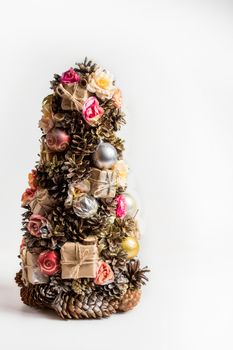 Homemade Christmas tree made of cones, Christmas toys and gifts - decoration for Christmas