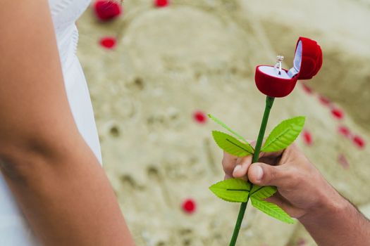 man giving gift box with engagement ring to woman. boyfriend making marriage proposal to girlfriend. Romance, birthday, anniversary, valentine, love, wedding concept