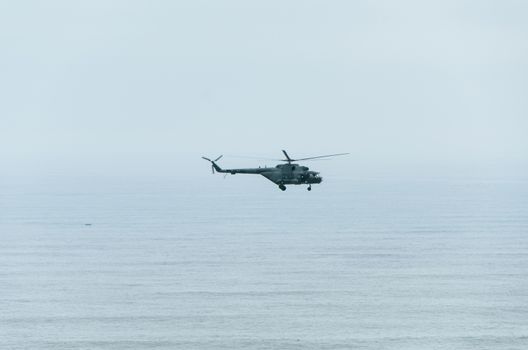 Helicopter in the air over the sea