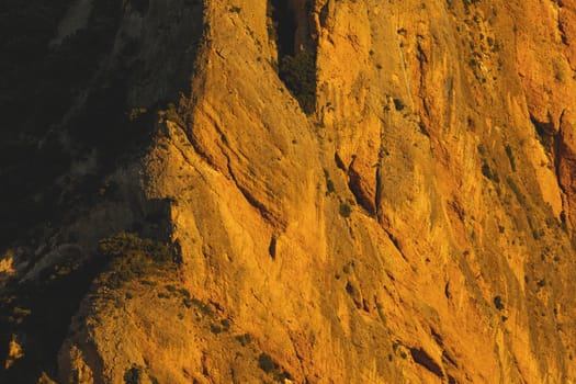 Mountains of the Mallos de Riglos, vertical rock walls at sunset, a famous place for climbing near the Gallego river, in the pre-Pyrenees, Huesca province, Aragon, Spain.