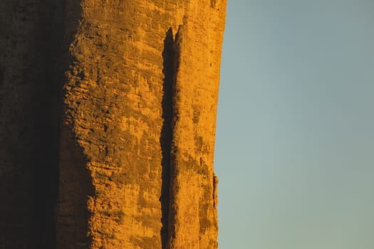 Mountains of the Mallos de Riglos, vertical rock walls at sunset, a famous place for climbing near the Gallego river, in the pre-Pyrenees, Huesca province, Aragon, Spain.