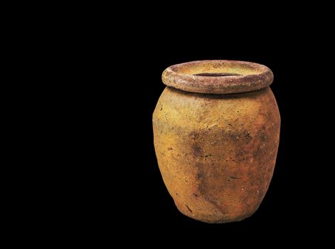 Old ancient jars on black background.