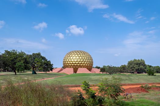Golden dome of Matrimandir - an edifice of spiritual significance for practitioners of Integral yoga, in the center of Auroville ,Pondicherry,India.