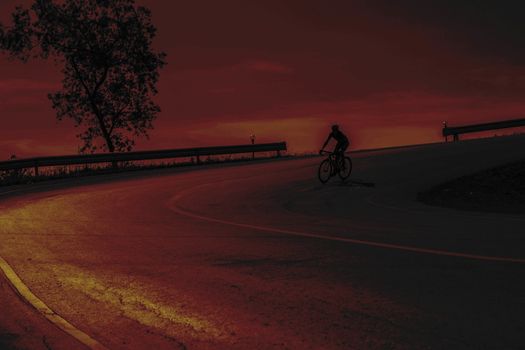 Cyclists are spun down at the sunset.