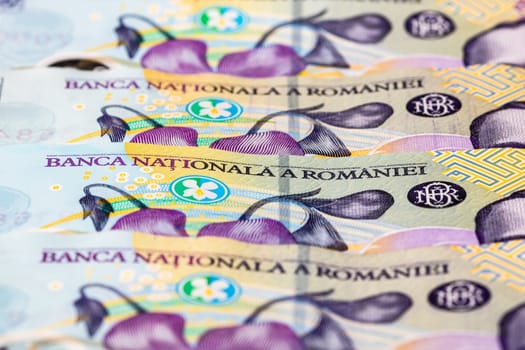 Selective focus on detail of lei banknotes. Close up macro detail of romanian lei banknotes, 100 lei isolated. World money concept, inflation and economy concept