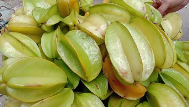 tasty and healthy carambola closeup on shop