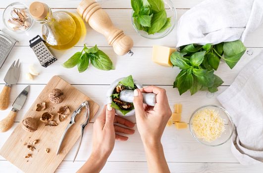 Italian Cuisine. Step by step cooking italian pesto sauce. Step 6 - pounding with a pestle till smooth paste