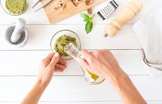 Italian Cuisine. Step by step cooking italian pesto sauce. Step 7 - adding some olive oil