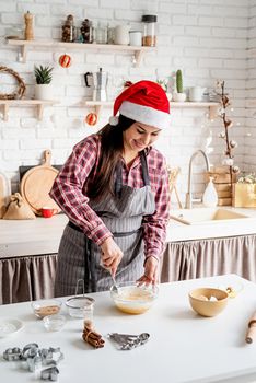 Cooking and baking. Young latin woman mixing dough cooking at the kitchen