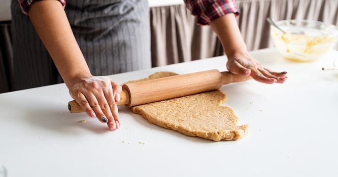 Cooking and baking. woman hands kneading dough at the kitchen