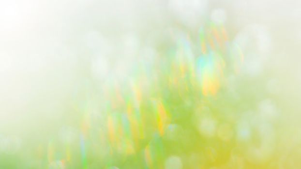 Bright green abstract background, blurred refraction effect, colorful bokeh