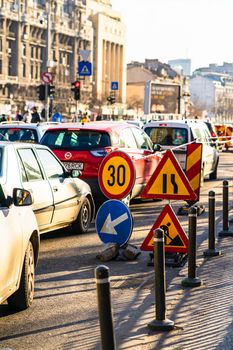 Speed limit, warning road signs located in working area. Bucharest, Romania, 2020