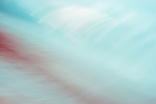 Abstract turquoise and red background, blurred motion